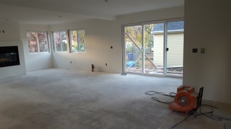 Looking from the kitchen towards the dining area where the triple sliding glass door is
