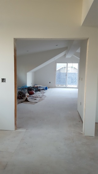 Looking into the master bedroom from the top of the stairs