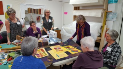 Betty showing examples of her stitching embellishments